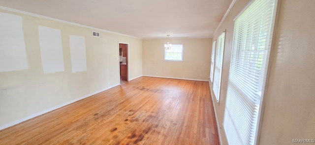 2804 Sumter Ave, Montgomery, AL 36109 - empty room with a chandelier, wood finished floors, and crown molding