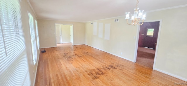 2804 Sumter Ave, Montgomery, AL 36109 - spare room featuring a chandelier, wood finished floors, and ornamental molding