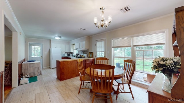 1706 Celia Ct, Montgomery, AL 36106 - dining area featuring ornamental molding and a chandelier