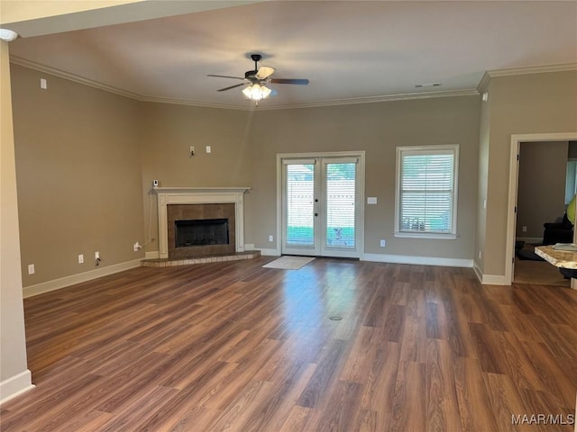 3701 Weston Pl, Montgomery, AL 36116 - unfurnished living room featuring a tile fireplace, ceiling fan, crown molding, and dark wood-style flooring