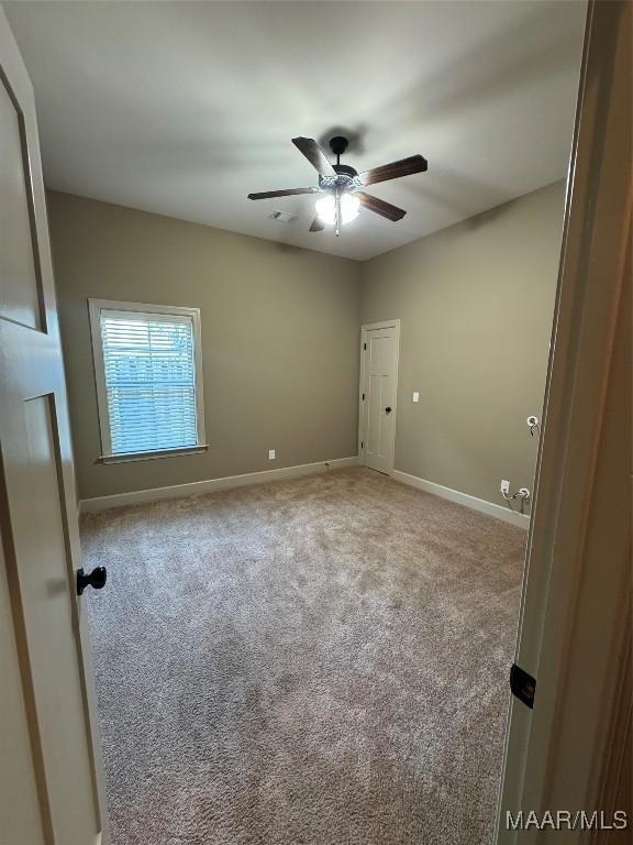 3701 Weston Pl, Montgomery, AL 36116 - carpeted spare room featuring a ceiling fan and baseboards
