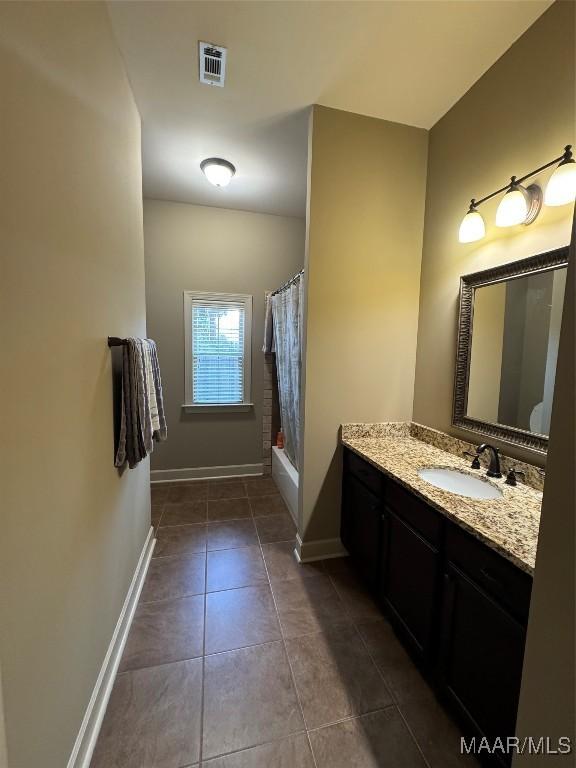 3701 Weston Pl, Montgomery, AL 36116 - full bath with vanity, tile patterned flooring, and shower / bath combo