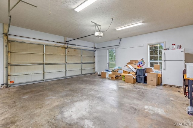 285 Cedar Ridge Dr, Wetumpka, AL 36093 - garage featuring freestanding refrigerator and a garage door opener