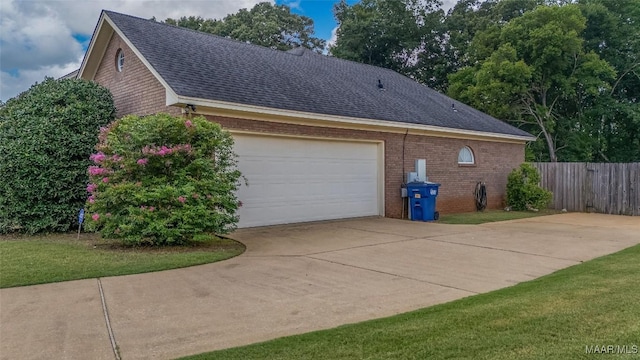 285 Cedar Ridge Dr, Wetumpka, AL 36093 - view of side of property with roof with shingles, brick siding, and a garage