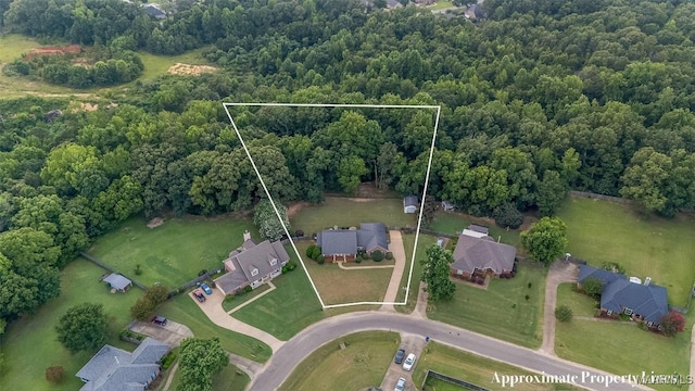 285 Cedar Ridge Dr, Wetumpka, AL 36093 - aerial view of residential area featuring property boundaries highlighted and a heavily wooded area