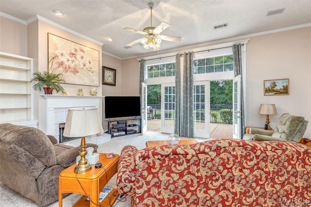 285 Cedar Ridge Dr, Wetumpka, AL 36093 - living area featuring ceiling fan, crown molding, carpet flooring, and a fireplace