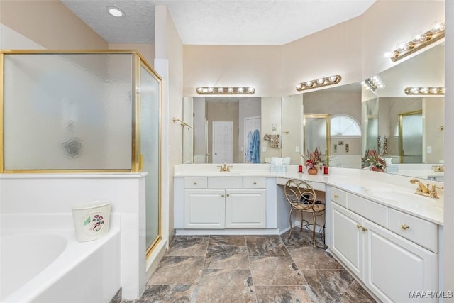 285 Cedar Ridge Dr, Wetumpka, AL 36093 - bathroom with a shower stall, a bath, vanity, and a textured ceiling