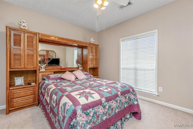 285 Cedar Ridge Dr, Wetumpka, AL 36093 - bedroom featuring light carpet, multiple windows, and ceiling fan