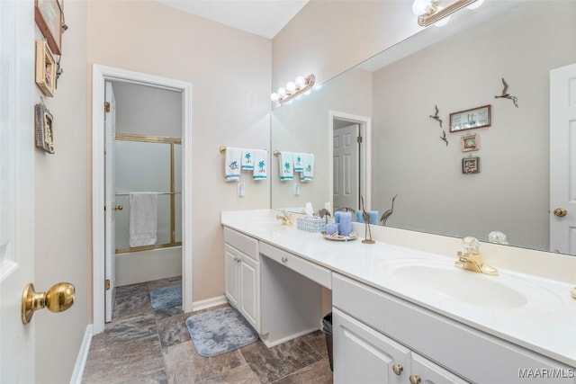 285 Cedar Ridge Dr, Wetumpka, AL 36093 - full bath featuring double vanity, stone finish floors, and combined bath / shower with glass door