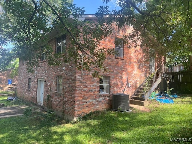 649 Partridge Ln, Prattville, AL 36067 - view of side of property with brick siding, a yard, and stairway