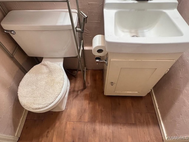 649 Partridge Ln, Prattville, AL 36067 - bathroom view of wood finished floors, vanity, and a textured wall