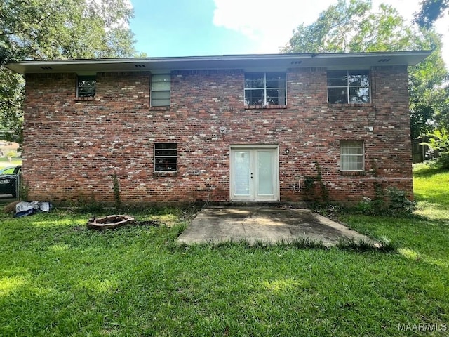 649 Partridge Ln, Prattville, AL 36067 - back of house featuring a lawn, brick siding, a patio, and french doors