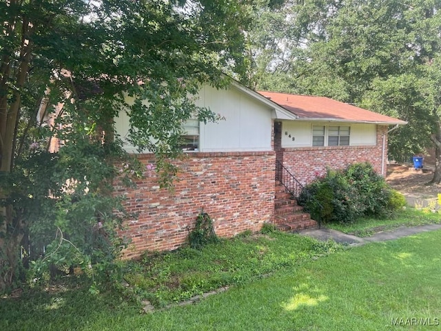 649 Partridge Ln, Prattville, AL 36067 - view of side of property with brick siding and a yard