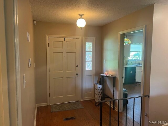 649 Partridge Ln, Prattville, AL 36067 - entryway featuring wood finished floors and a textured ceiling