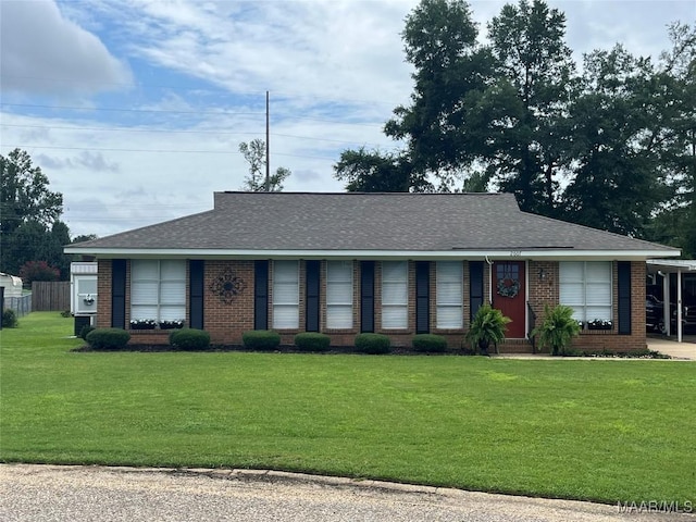 2607 Pine Tree Cir, Selma, AL 36701 - view of front of house with a front yard, brick siding, and roof with shingles