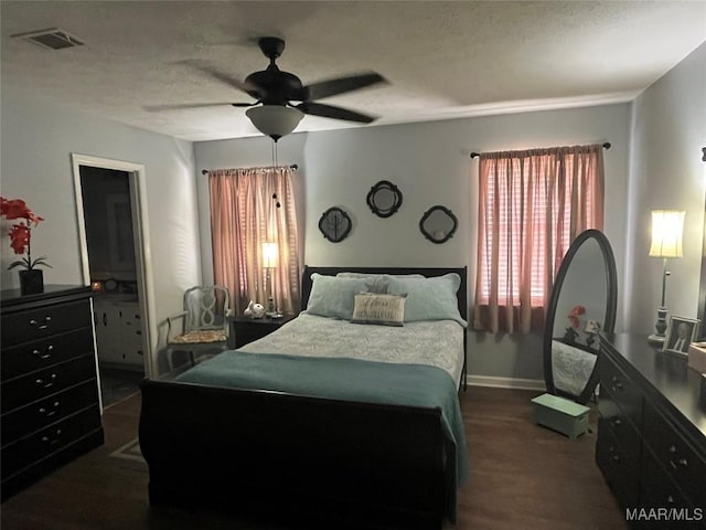 2607 Pine Tree Cir, Selma, AL 36701 - bedroom with ceiling fan and dark wood-type flooring