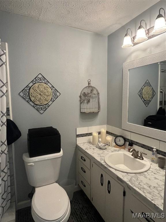 2607 Pine Tree Cir, Selma, AL 36701 - bathroom with a textured ceiling, vanity, tile patterned floors, and a shower with curtain