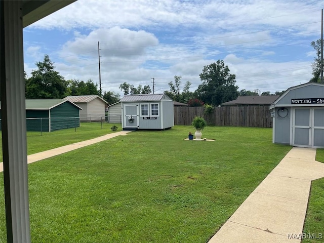 2607 Pine Tree Cir, Selma, AL 36701 - fenced backyard featuring a storage shed