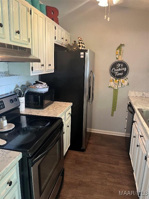 2607 Pine Tree Cir, Selma, AL 36701 - kitchen featuring black appliances, under cabinet range hood, dark wood finished floors, and white cabinets