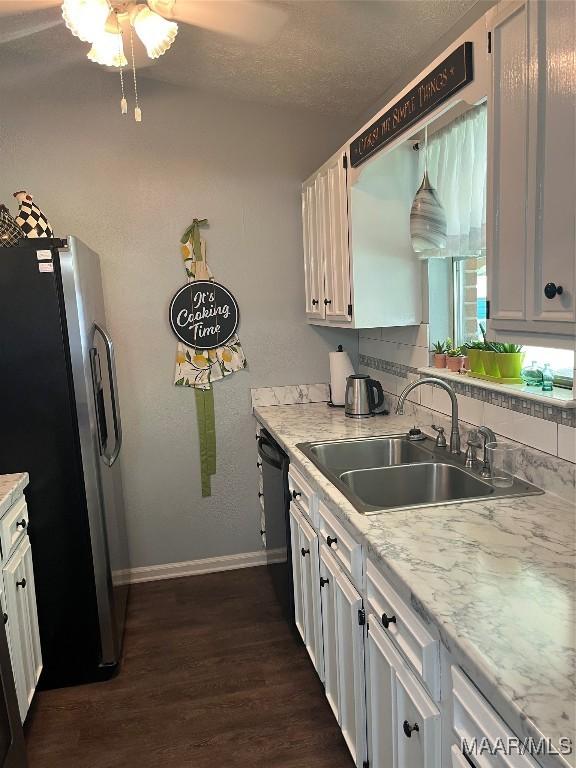 2607 Pine Tree Cir, Selma, AL 36701 - kitchen with stainless steel refrigerator with ice dispenser, dark wood-style flooring, light countertops, and a textured ceiling