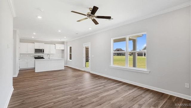 6028 Cunningham Trl, Montgomery, AL 36116 - unfurnished living room with ornamental molding, wood finished floors, recessed lighting, and a ceiling fan