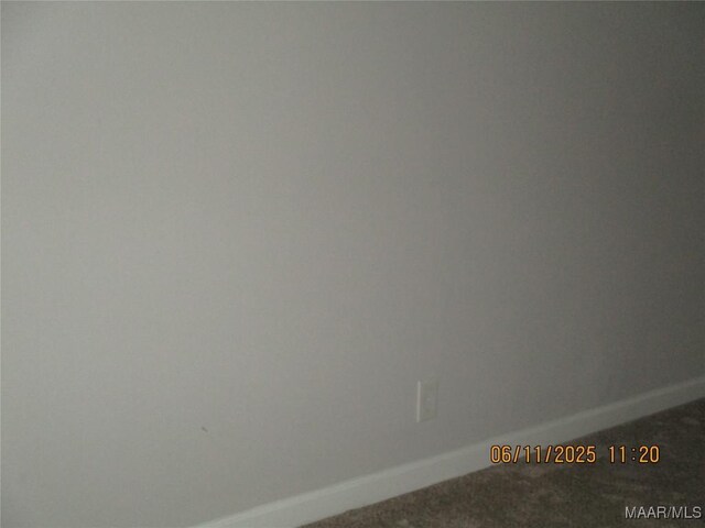 398 Birch Ave, Selma, AL 36701 - unfurnished room with baseboards and carpet flooring