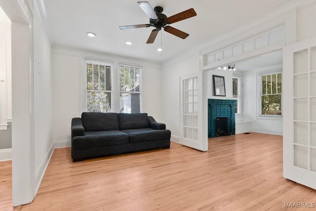 610 Ponce De Leon Ave, Montgomery, AL 36106 - living room with light wood-style floors, crown molding, a fireplace, ceiling fan, and recessed lighting