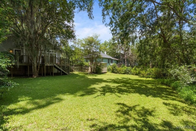 610 Ponce De Leon Ave, Montgomery, AL 36106 - view of green lawn with stairway and a deck