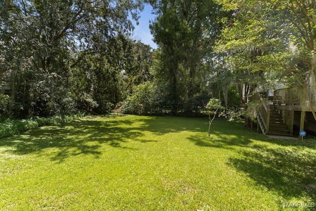 610 Ponce De Leon Ave, Montgomery, AL 36106 - view of grassy yard featuring stairway and a deck