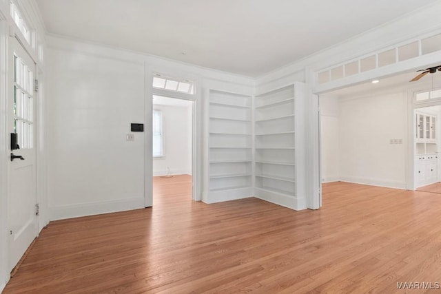 610 Ponce De Leon Ave, Montgomery, AL 36106 - empty room featuring ornamental molding, light wood-type flooring, built in features, and a ceiling fan
