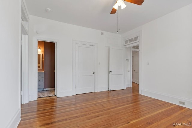 610 Ponce De Leon Ave, Montgomery, AL 36106 - unfurnished bedroom featuring light wood-type flooring, a ceiling fan, and connected bathroom