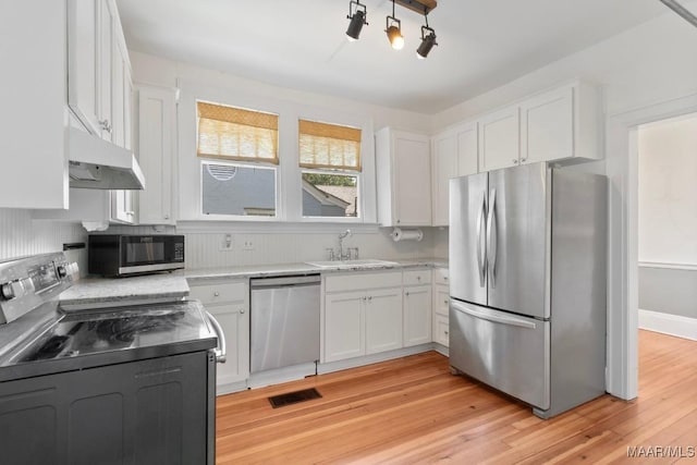 610 Ponce De Leon Ave, Montgomery, AL 36106 - kitchen featuring appliances with stainless steel finishes, under cabinet range hood, and white cabinetry