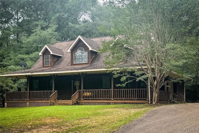 1267 County Road 85th Rd, Prattville, AL 36067 - farmhouse featuring covered porch, a shingled roof, and a front yard
