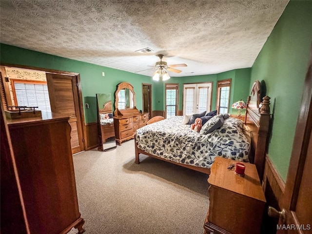 1267 County Road 85th Rd, Prattville, AL 36067 - carpeted bedroom featuring multiple windows, a textured ceiling, and ceiling fan