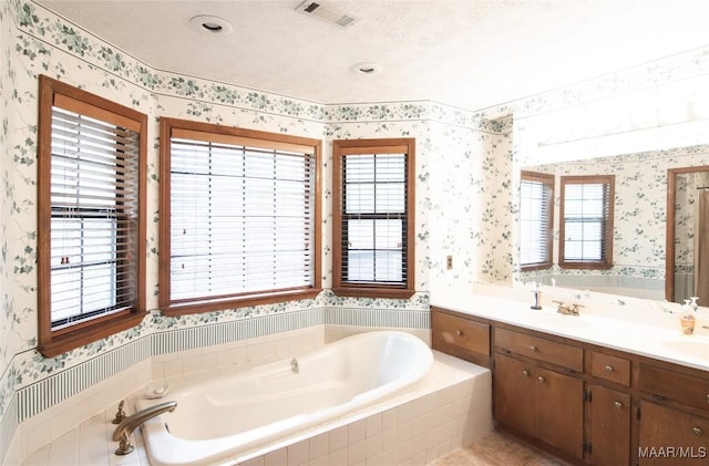 1267 County Road 85th Rd, Prattville, AL 36067 - bathroom with wallpapered walls, a garden tub, double vanity, and healthy amount of natural light