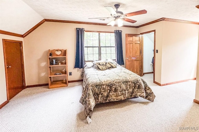 1267 County Road 85th Rd, Prattville, AL 36067 - bedroom with light carpet, a ceiling fan, vaulted ceiling, a textured ceiling, and crown molding