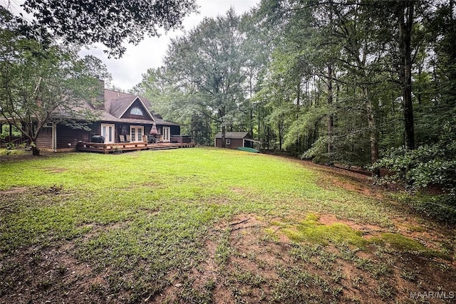 1267 County Road 85th Rd, Prattville, AL 36067 - view of grassy yard featuring a wooden deck and a storage shed