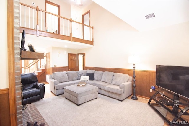 1267 County Road 85th Rd, Prattville, AL 36067 - living area with a wainscoted wall, carpet floors, wooden walls, and stairs