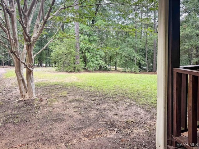 1267 County Road 85th Rd, Prattville, AL 36067 - view of green lawn with a wooded view