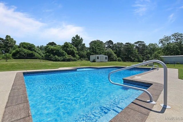 709 Liberty Rd, Tallassee, AL 36078 - outdoor pool with a lawn and a storage shed