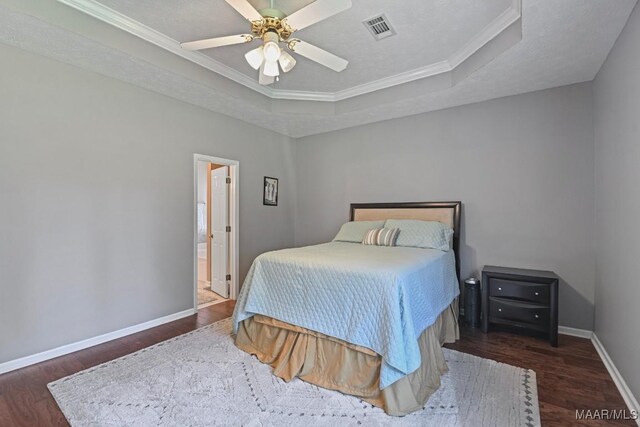 709 Liberty Rd, Tallassee, AL 36078 - bedroom with wood finished floors, a raised ceiling, crown molding, and ceiling fan