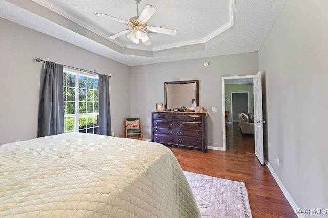 709 Liberty Rd, Tallassee, AL 36078 - bedroom featuring a raised ceiling, wood finished floors, crown molding, and ceiling fan