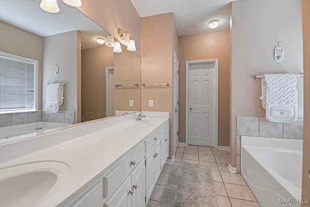 709 Liberty Rd, Tallassee, AL 36078 - full bathroom featuring double vanity, a bath, and tile patterned flooring