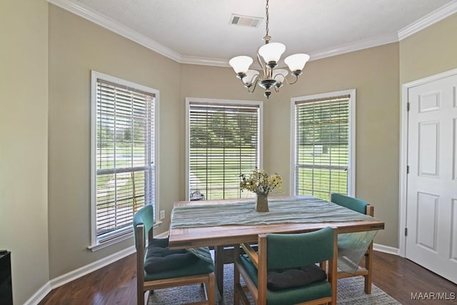 709 Liberty Rd, Tallassee, AL 36078 - dining space featuring a chandelier, ornamental molding, and dark wood-type flooring