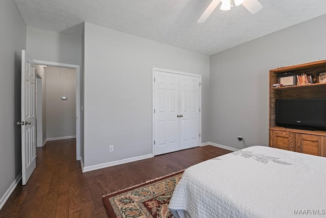 709 Liberty Rd, Tallassee, AL 36078 - bedroom featuring dark wood-style floors, a closet, and a ceiling fan