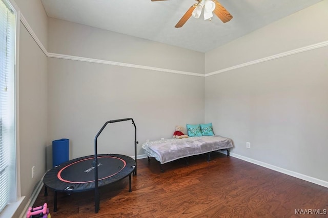 709 Liberty Rd, Tallassee, AL 36078 - bedroom featuring wood finished floors, a ceiling fan, and multiple windows