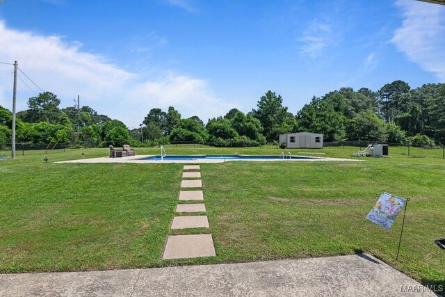 709 Liberty Rd, Tallassee, AL 36078 - view of green lawn featuring an outdoor pool and view of scattered trees
