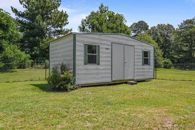 709 Liberty Rd, Tallassee, AL 36078 - view of shed with a fenced backyard