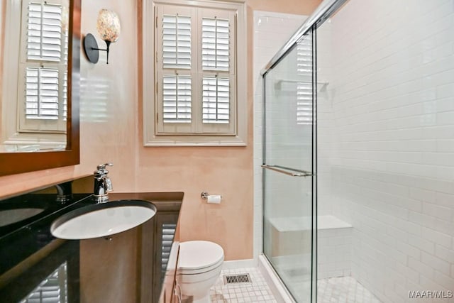 1327 Woodward Ave, Montgomery, AL 36106 - full bath featuring a shower stall, vanity, and tile patterned flooring