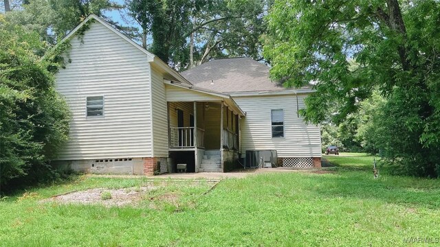 905 Milly Francis St, Wetumpka, AL 36092 - back of property with a yard, crawl space, covered porch, and a shingled roof